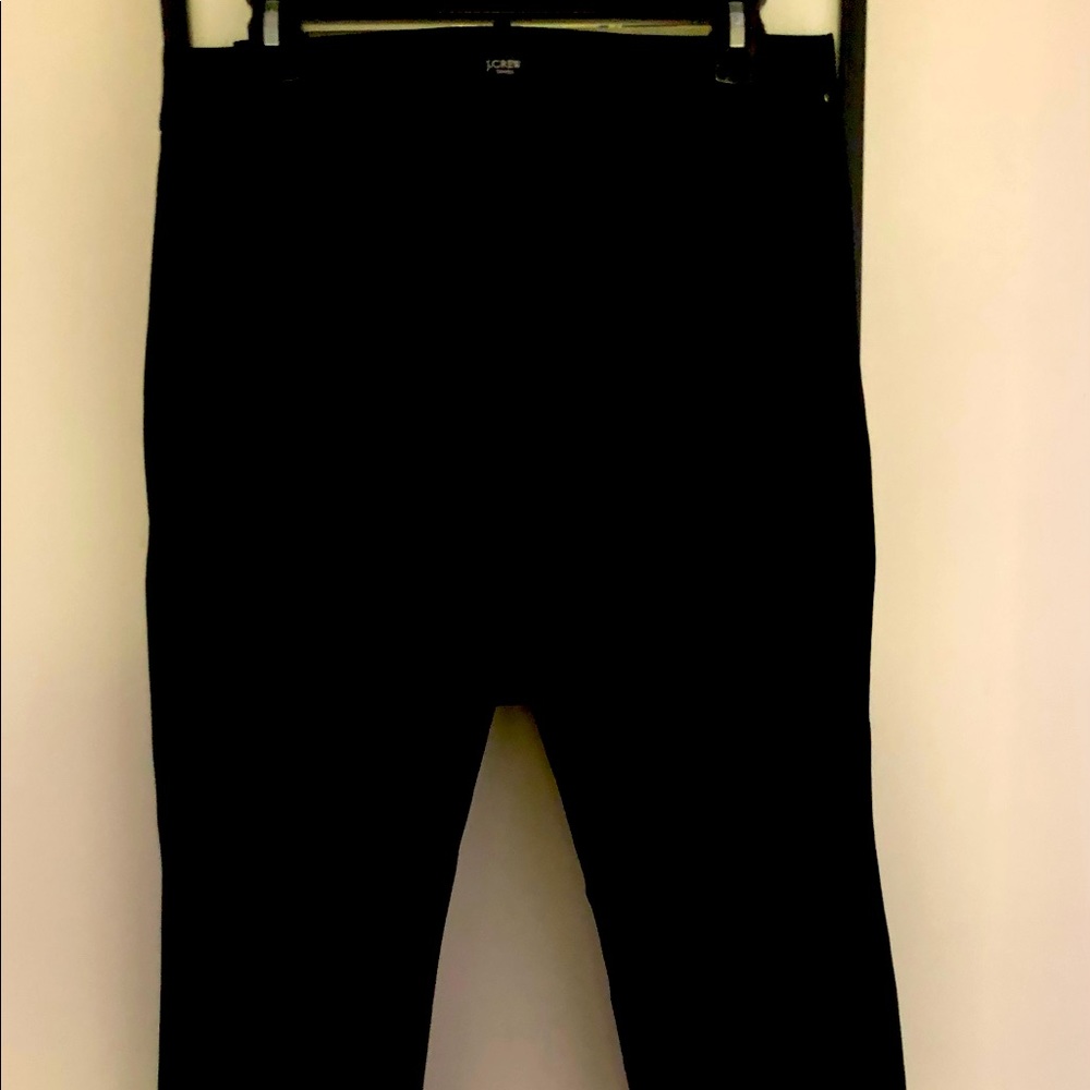 Slim, stretch crop black pant with side zip.